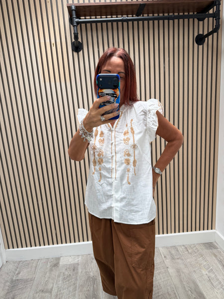 Embroidered front frill blouse