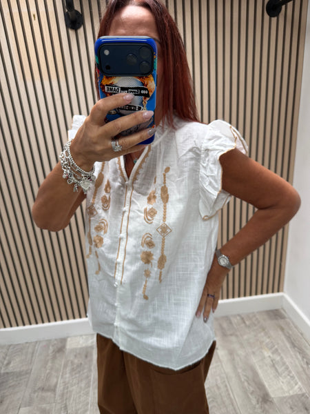 Embroidered front frill blouse