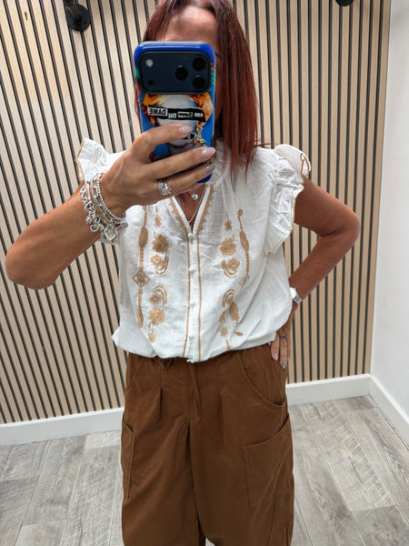 Embroidered front frill blouse