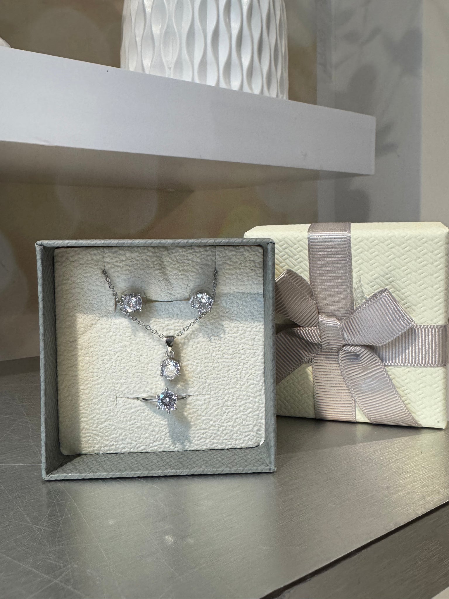 Solitaire necklace / earrings / ring set
